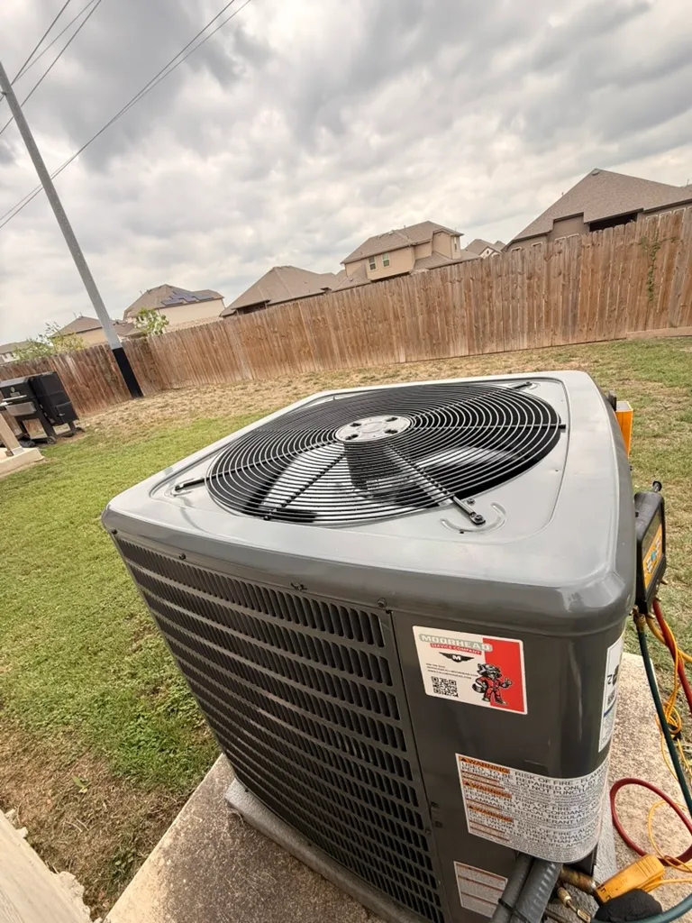 A newly installed outdoor AC condenser at a Texas home.