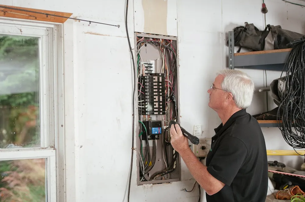 Licensed Moorhead electrician working in a residential panel