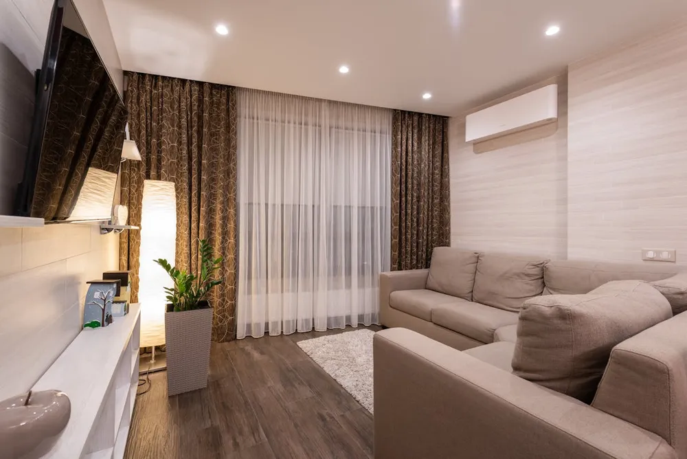 A comfortable, cooled living room representing summer air conditioning use.