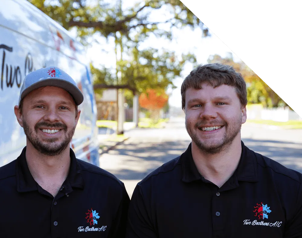 Image of Moorhead Service Company technician smiling next to a service vehicle.