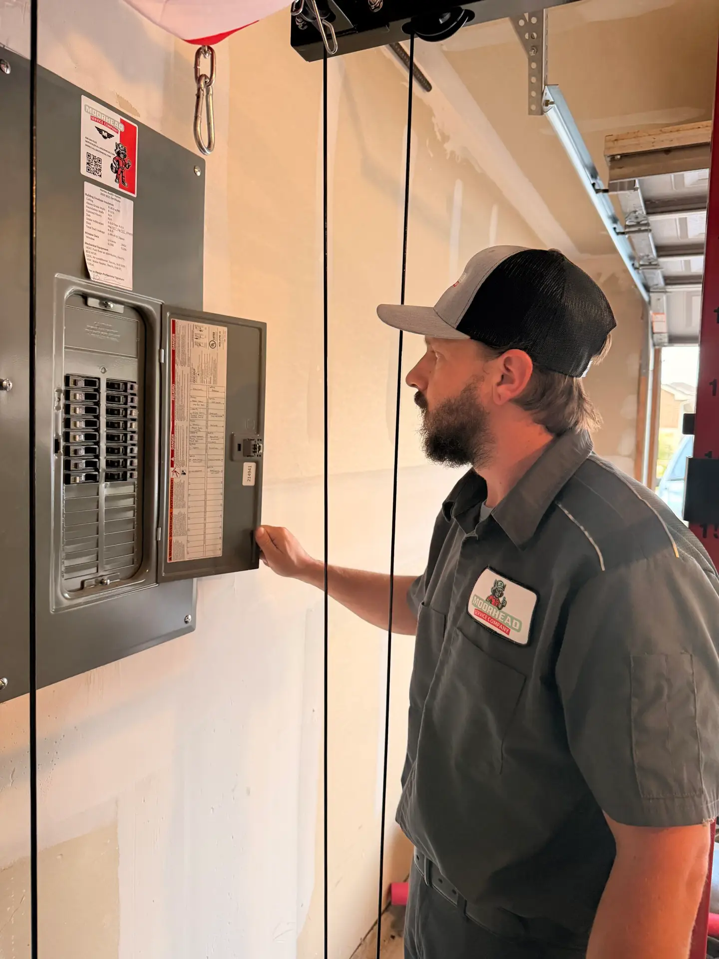 Moorhead Service Company licensed HVAC and electrician performing AC maintenance with electrical inspection in New Braunfels TX